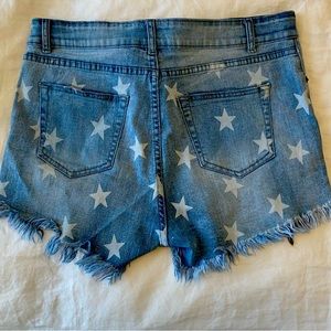 Star spangled ripped denim shorts plus size